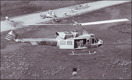 A factory-fresh Model 212 dropping hay bales in a floaded region of Africa