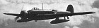 Study in cloudscapes. Previously illustrated in the shed, K7721 now displays the production-standard bomb containers providing space for two 225kg or four 110kg bombs in each pannier.